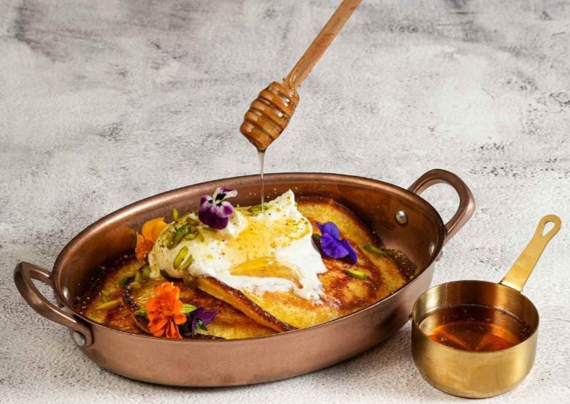 ťazal's chebab is served with a sweet date molasses for breakfast. Image credit: ťazal